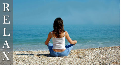 Relax with Artesian Hot Tubs - girl on beach meditating
